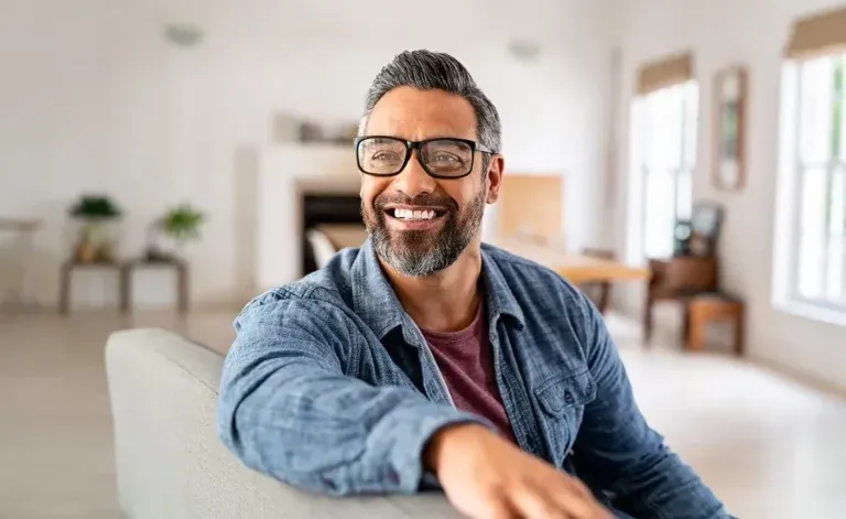 Person smiling with renewed energy after hormone therapy.